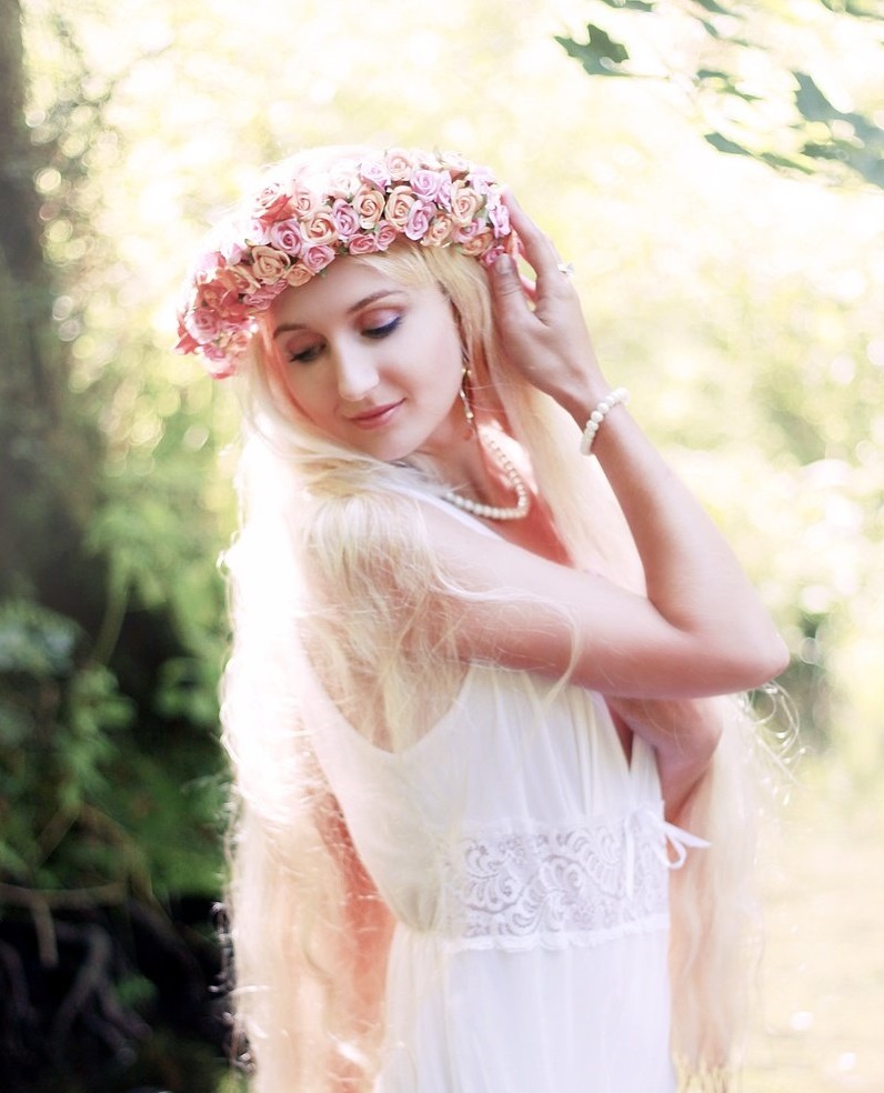 thin long hair blonde fairy in white dress and flower crown