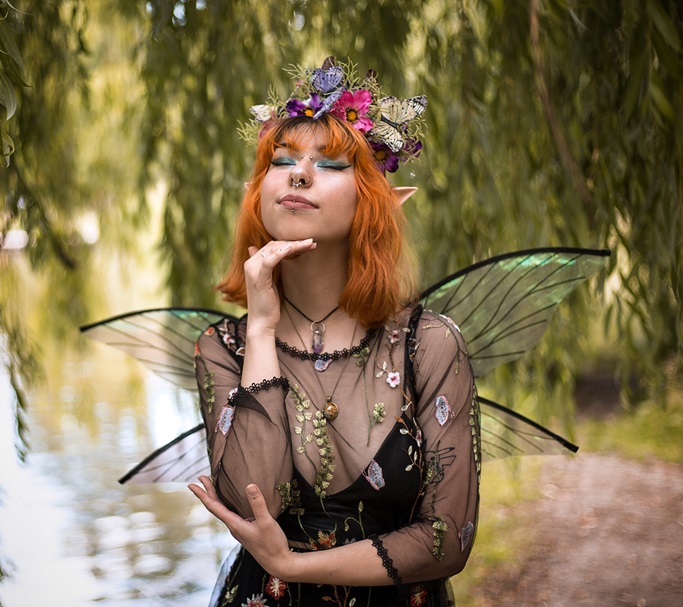 elf red hair girl with lot of flowers and black wings
