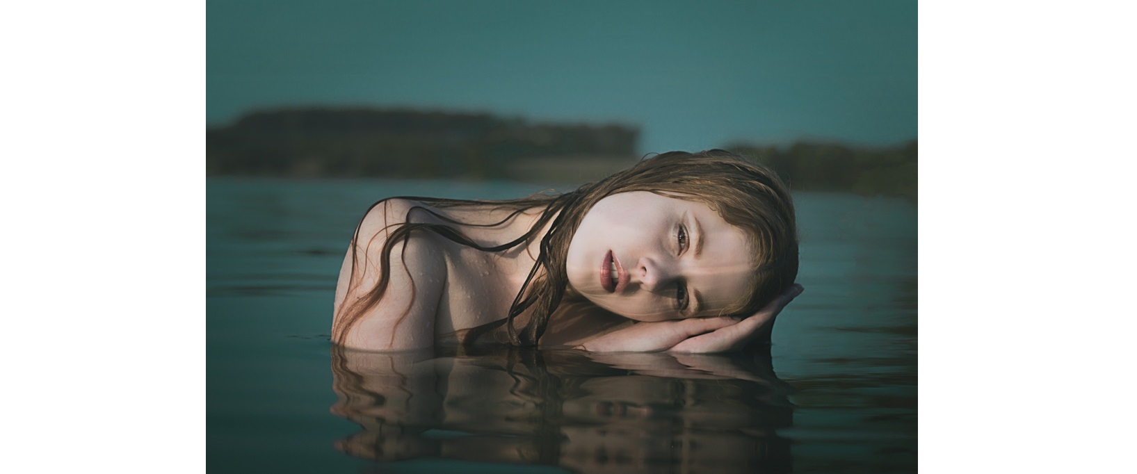 girl laying on water