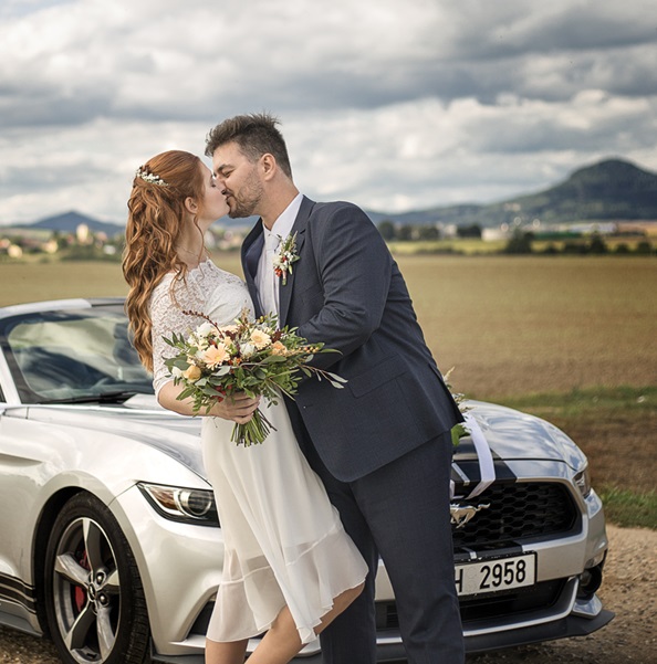 car and wedding kiss